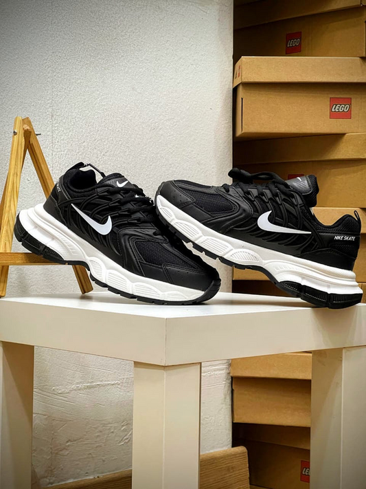 NIKE STAKE NEGRO BLANCO